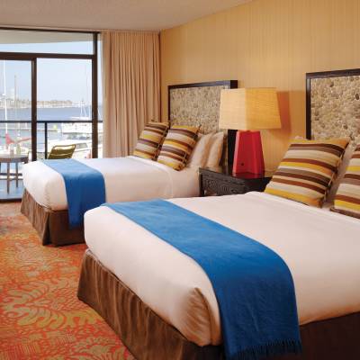 a bedroom with a large bed in a hotel room