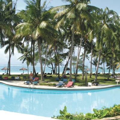 a pool next to a palm tree
