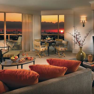a living room filled with furniture and a large window