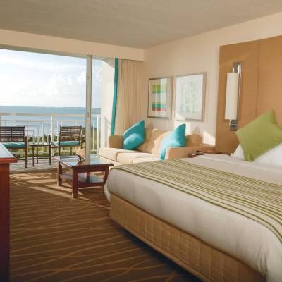 a bedroom with a large bed in a hotel room