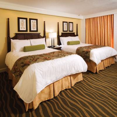 a bedroom with a large bed in a hotel room