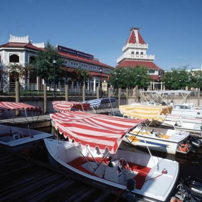 a boat is docked next to a building