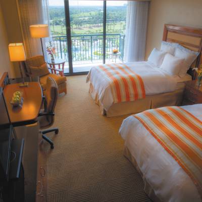 a bedroom with a bed in a hotel room