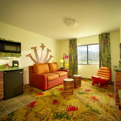 a living room filled with furniture and a flat screen tv