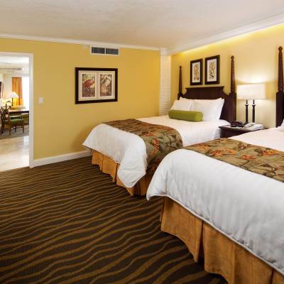 a bedroom with a large bed in a hotel room
