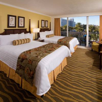 a bedroom with a large bed in a hotel room