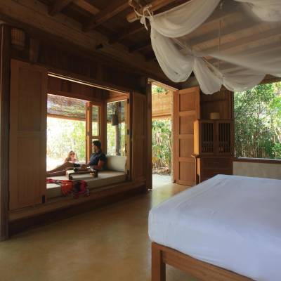 a bedroom with a large window
