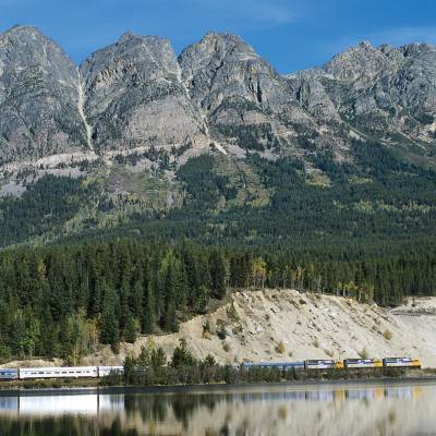 a body of water with a mountain in the background