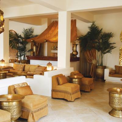 a living room filled with furniture and vase on a table