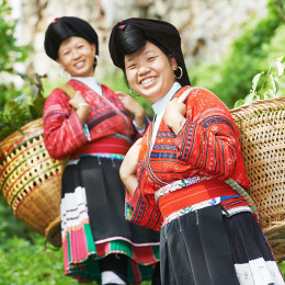 Enchanting Travels China Tours Group of happy chinese minority woman Yao in traditional dresses outdoors - China travel guide