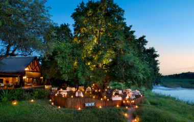 Outdoor dinner area at Lion Sands Tinga Lodge Hotel, South Kruger in South Africa