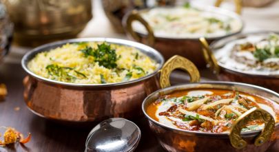 Enchanting Travels Indian Food in brass bowl - Indian Restaurant Guide