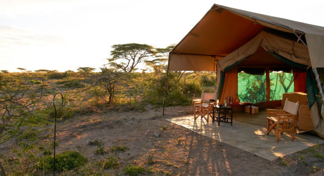 Outdoor area of a guest tent at Ubuntu Camp S Hotel in Serengeti (Southern), Tanzania