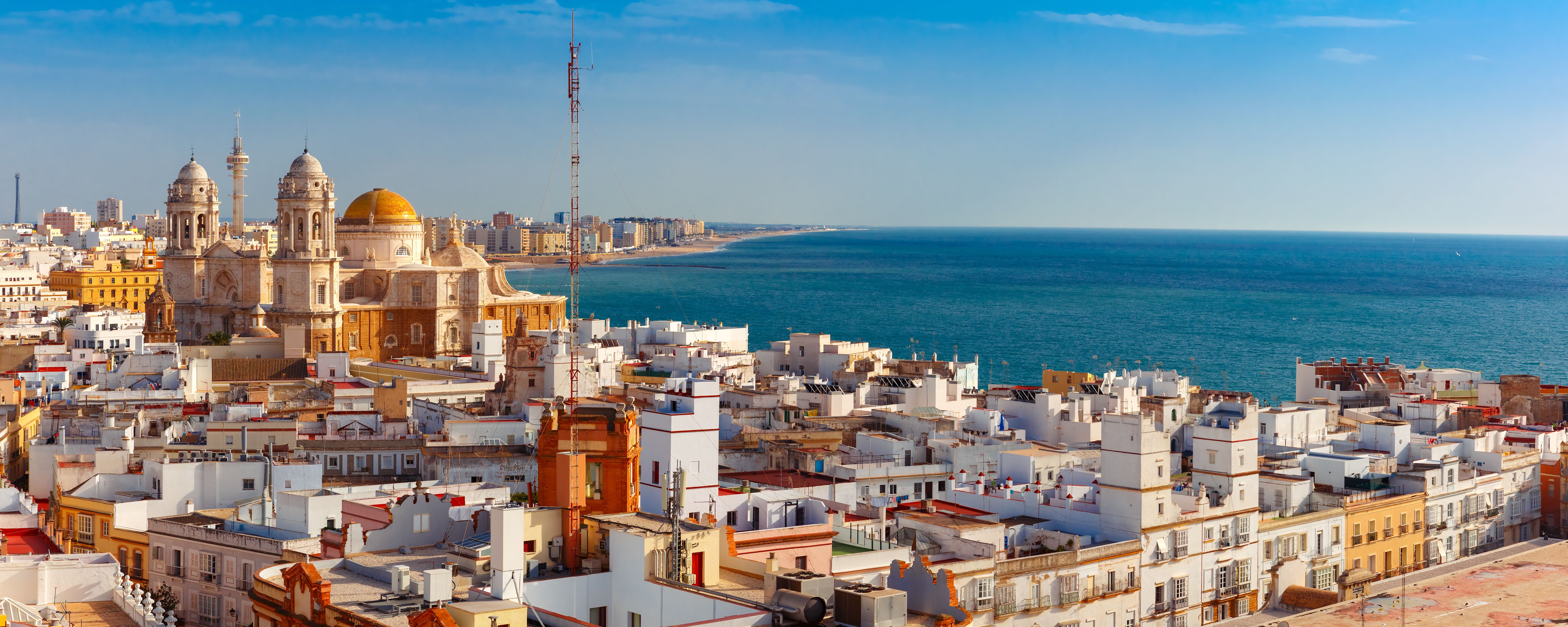 Aerial panoramic view of the old city rooftops and Cathedral de Santa Cruz in the morning from tower Tavira in Cadiz, Andalusia, Spain Best time to visit Spain