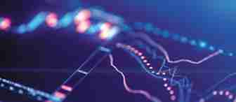 Close-up image of a digital screen displaying a financial graph with fluctuating data lines in shades of blue and orange. The background is slightly blurred, highlighting the dynamic movement and trends in the data.