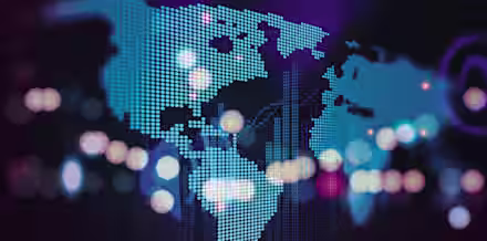 A digital world map is depicted with glowing blue dots representing continents on a dark background. Bright, multicolored bokeh lights are scattered across the image, adding a dynamic and futuristic feel.