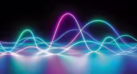 A digital abstract image featuring colorful waveforms of neon light against a black background. The waves, in shades of blue, purple, and pink, appear to overlap and flow, creating a vibrant, dynamic visual effect on a reflective surface.