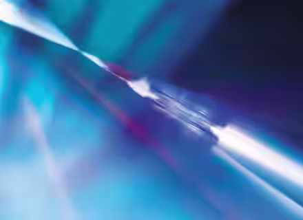 A vibrant, abstract image featuring a dynamic blend of blue and white hues. Light streaks and soft gradients create a sense of movement and fluidity, evoking a feeling of motion and energy. The overall effect is ethereal and visually engaging.