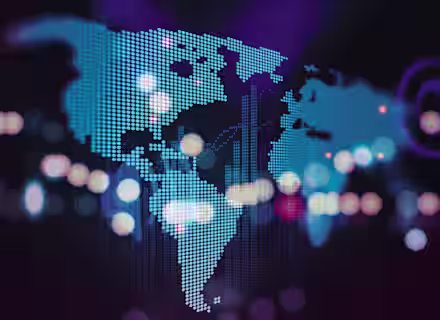 A digital world map is depicted with glowing blue dots representing continents on a dark background. Bright, multicolored bokeh lights are scattered across the image, adding a dynamic and futuristic feel.