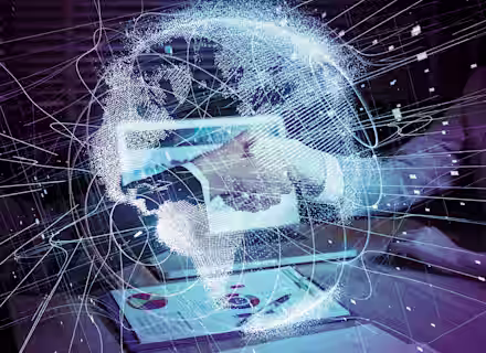 A person interacts with a virtual globe interface, seemingly projected from a tablet on a desk. The globe displays interconnected lines and data points. A document with charts and graphs is visible on the desk. The setting appears to be an office.