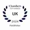 A circular laurel wreath surrounds the text "Chambers TOP RANKED UK 2024 Fieldfisher" in blue font, signifying a top ranking award given by Chambers to the law firm Fieldfisher for the year 2024.