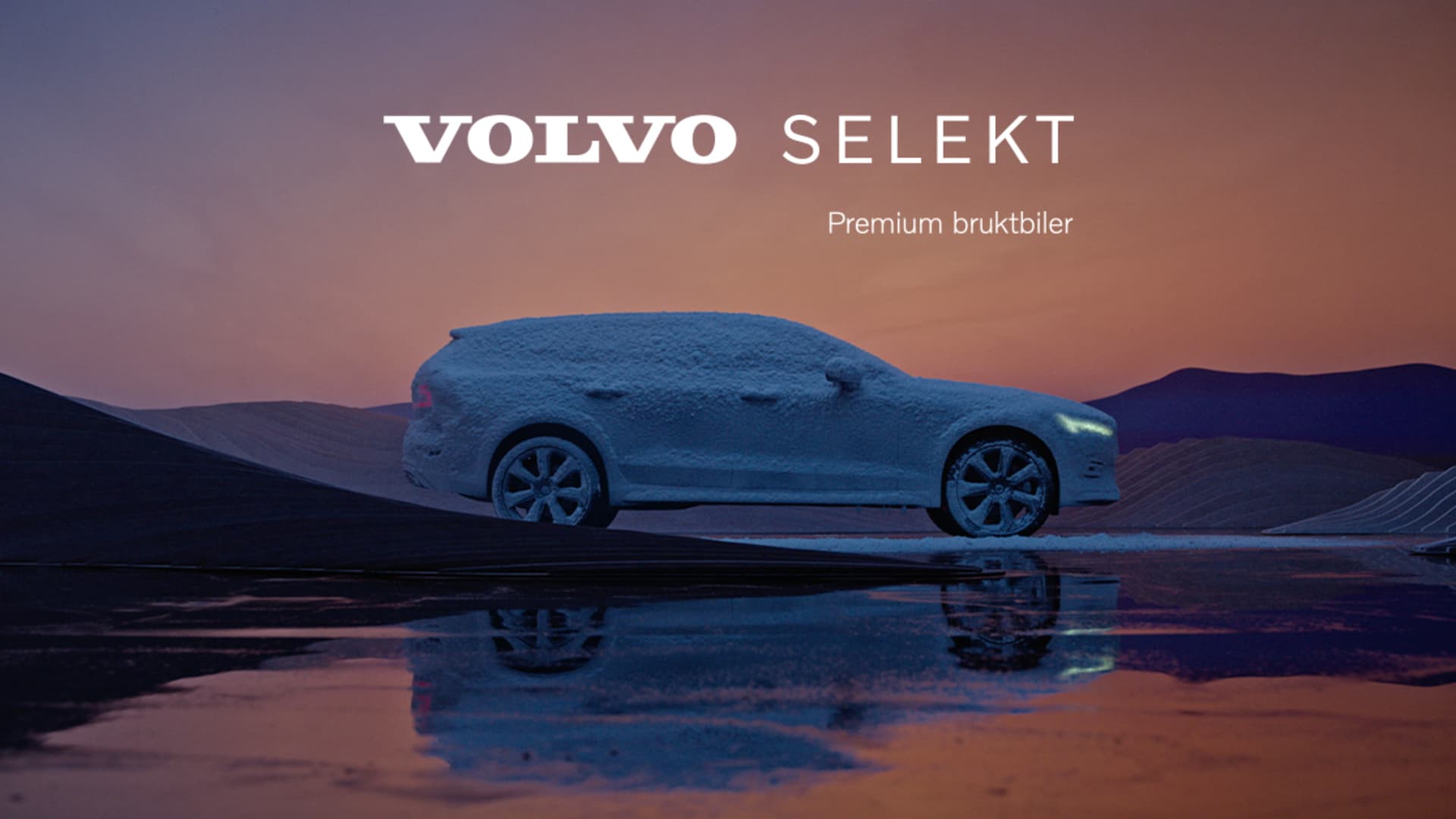 Brukt Volvo V60 fra Frydenbø Bilsenter parkert foran vinterkledd fjell.