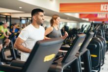 image shows people running on a treadmil
