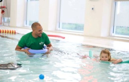 swim teacher and child