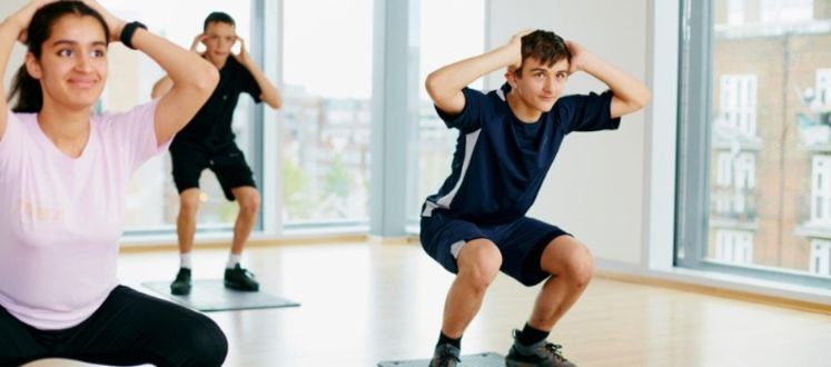 teenagers performing squats