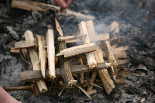 small fire made from foraged sticks 