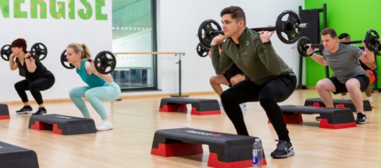 Customers taking part in a weights class