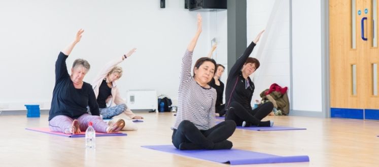 The picture shows members enjoying a Mind & Body class with Better