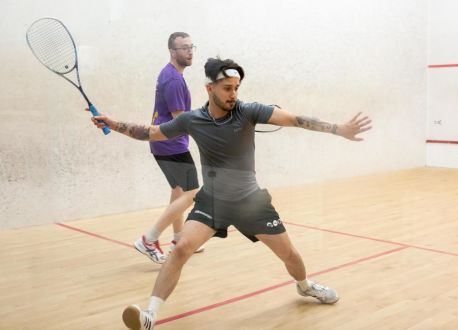 two men playing squash