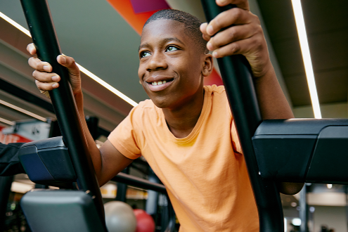 Boy on gym equipment