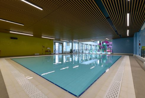 square teaching pool yellow walls and slatted wooden ceiling