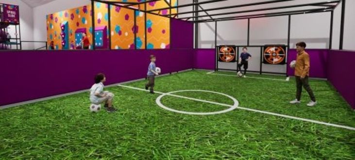 image shows a render of the design for the Interactive Sports Pitch, a bright green surface with interactive features