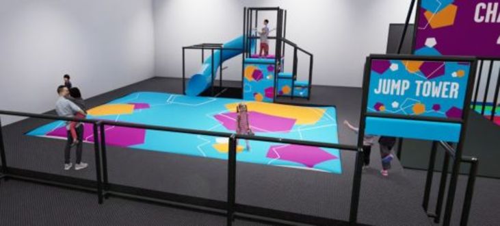 image shows a render of the design for the jump tower and air bag, a brightly coloured structure which you can jump from to land on the airbag below