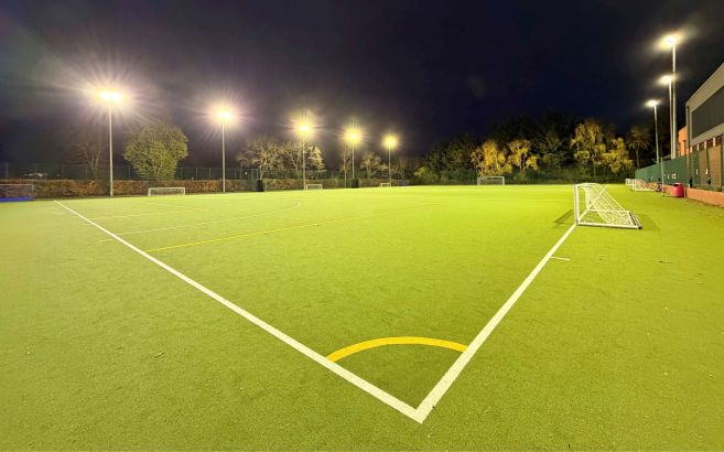Floodlit all weather pitch at night