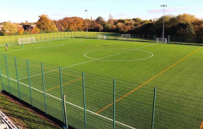 Side view of floodlit pitch at Lincoln Field