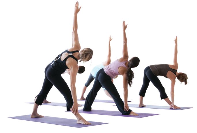 Females doing a yoga stretch