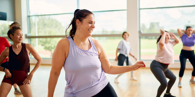 Women working out a women-only Zumba class Women working out a women-only Zumba class