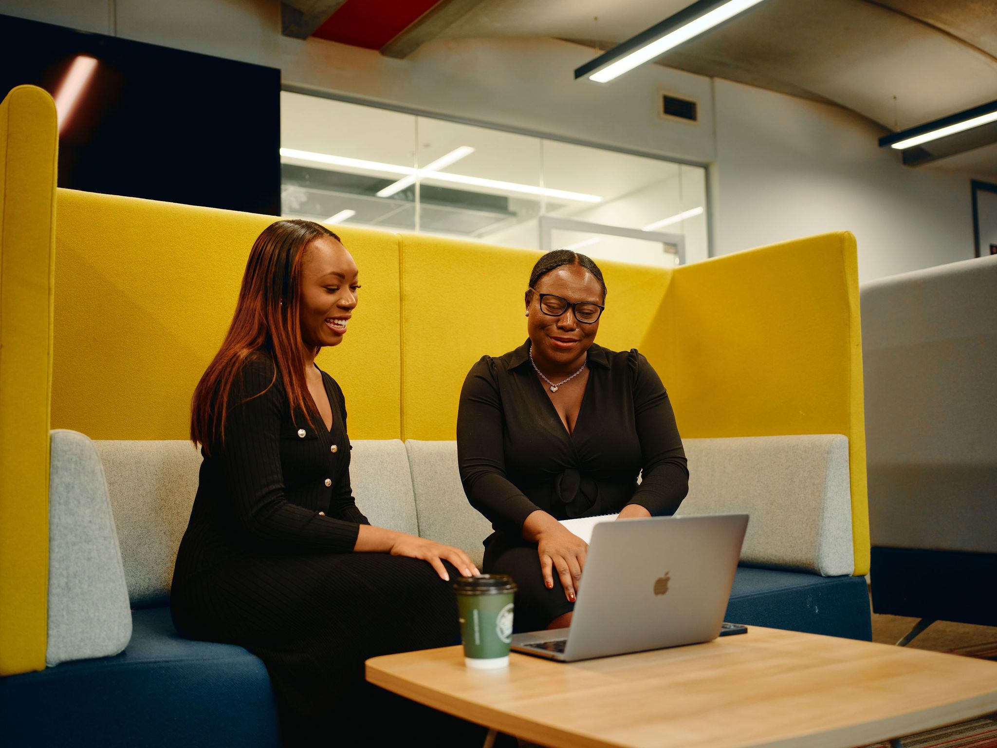 Two women in the library working