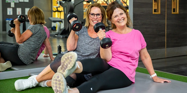 Two women working out at the gym