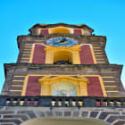 Tower of Sorrento Cathedral With Red and Yellow Accents