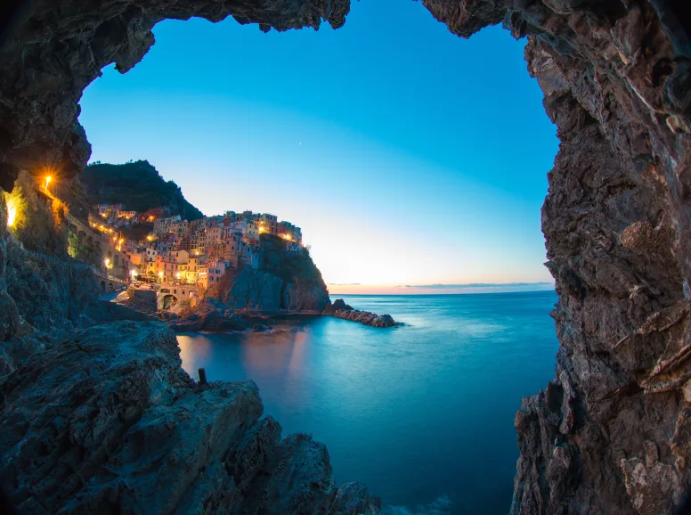 Cave Looking Out to a Village by the Sea in Cinque Terre