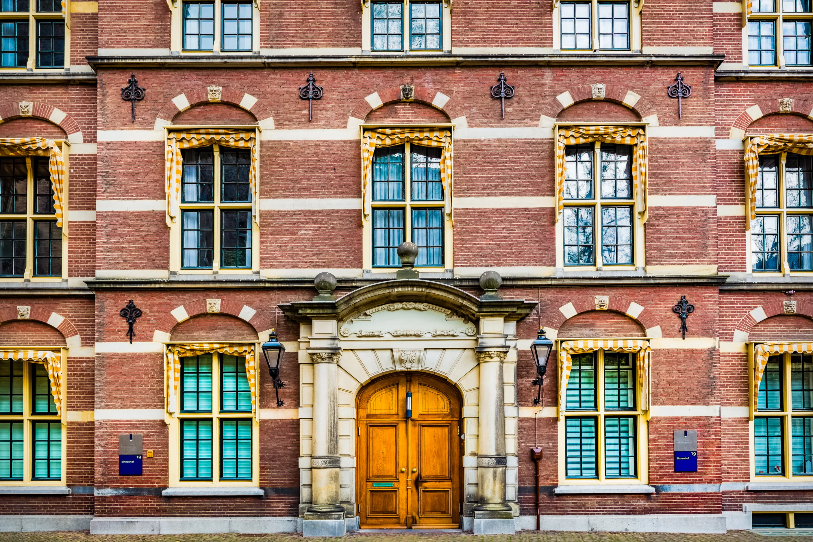 A Brick Building with White Detail Around the Windows