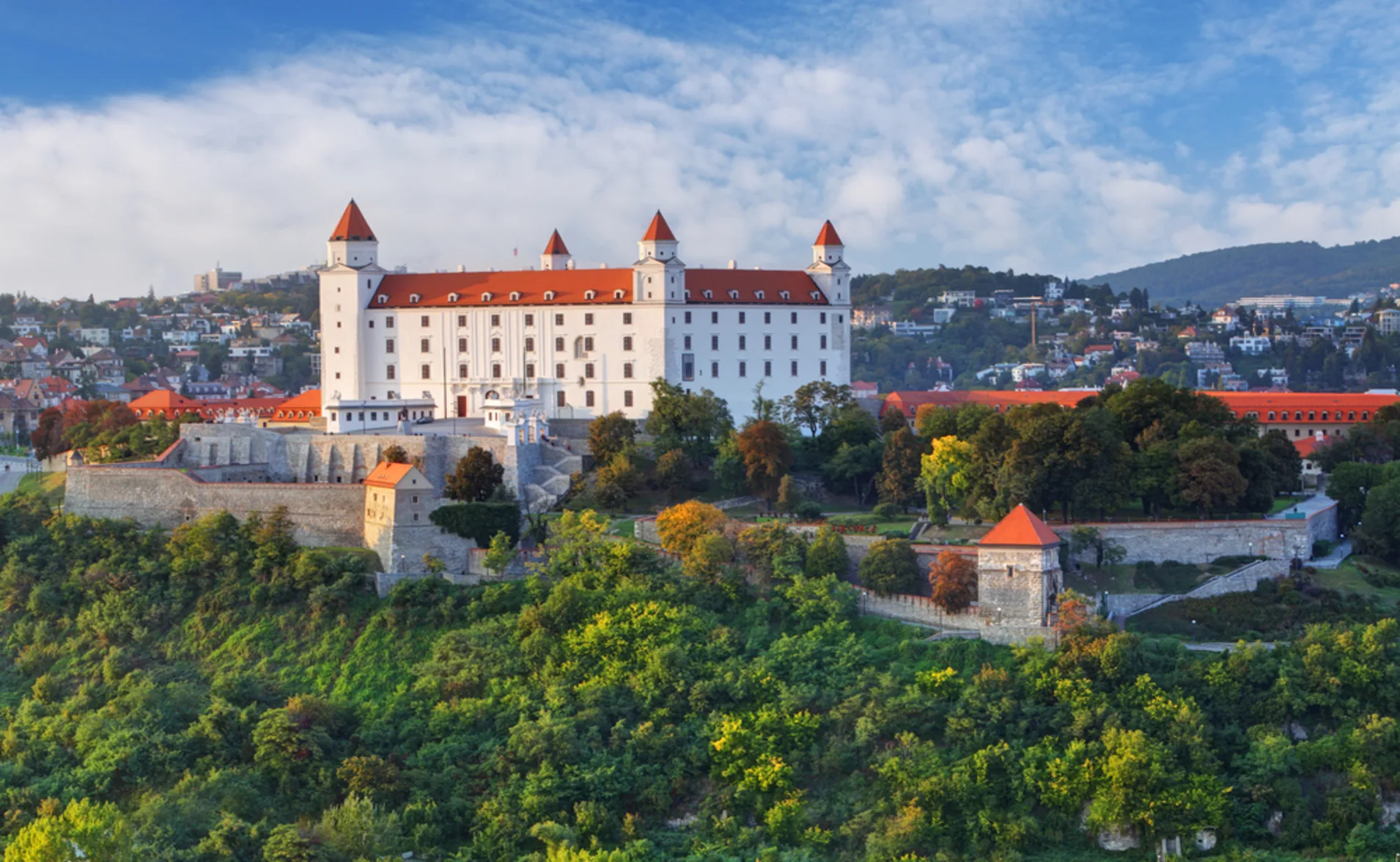 The white and red Bratislava castle on a hilltop