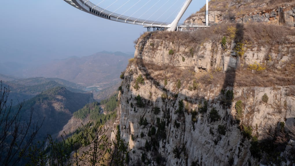 View looking up at the Tanxishan glass landscape pedestrian bridge