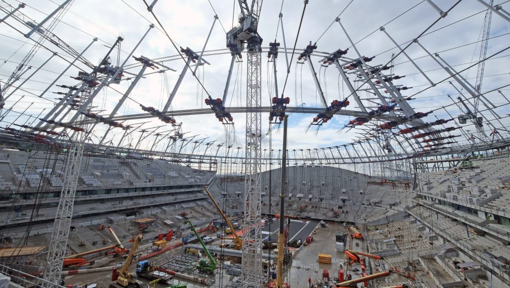 Pitch side view of construction work at the Tottenham Hotspur stadium