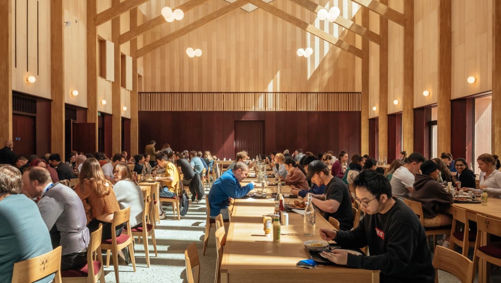 Interior ground level view of people dining in the Homerton Dining Hall